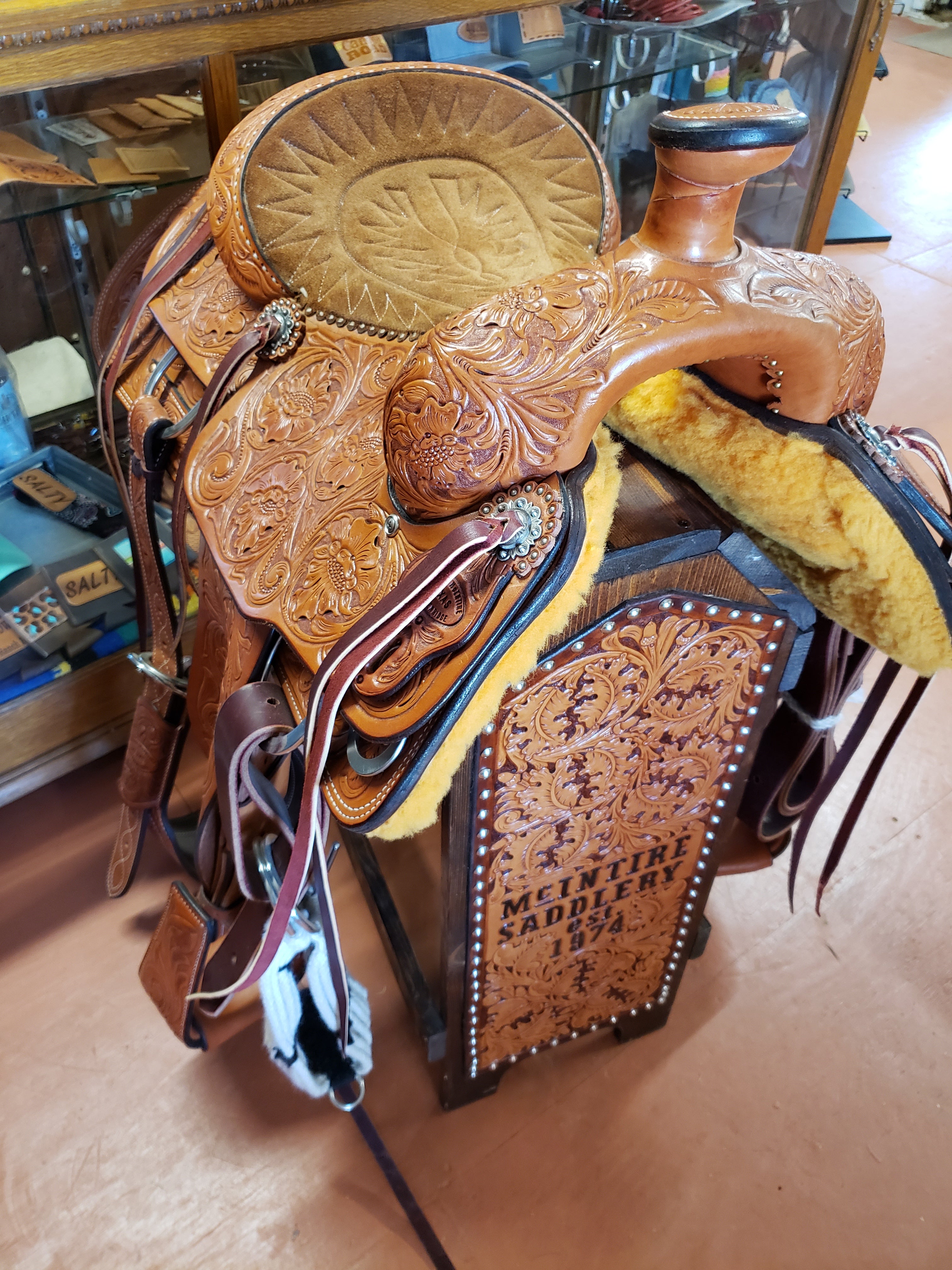 16 Semi acorn tooled Buffalo roper style saddle with rawhide silver laced  cantle.